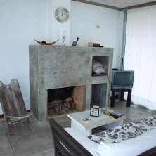 Living con hogar a leña